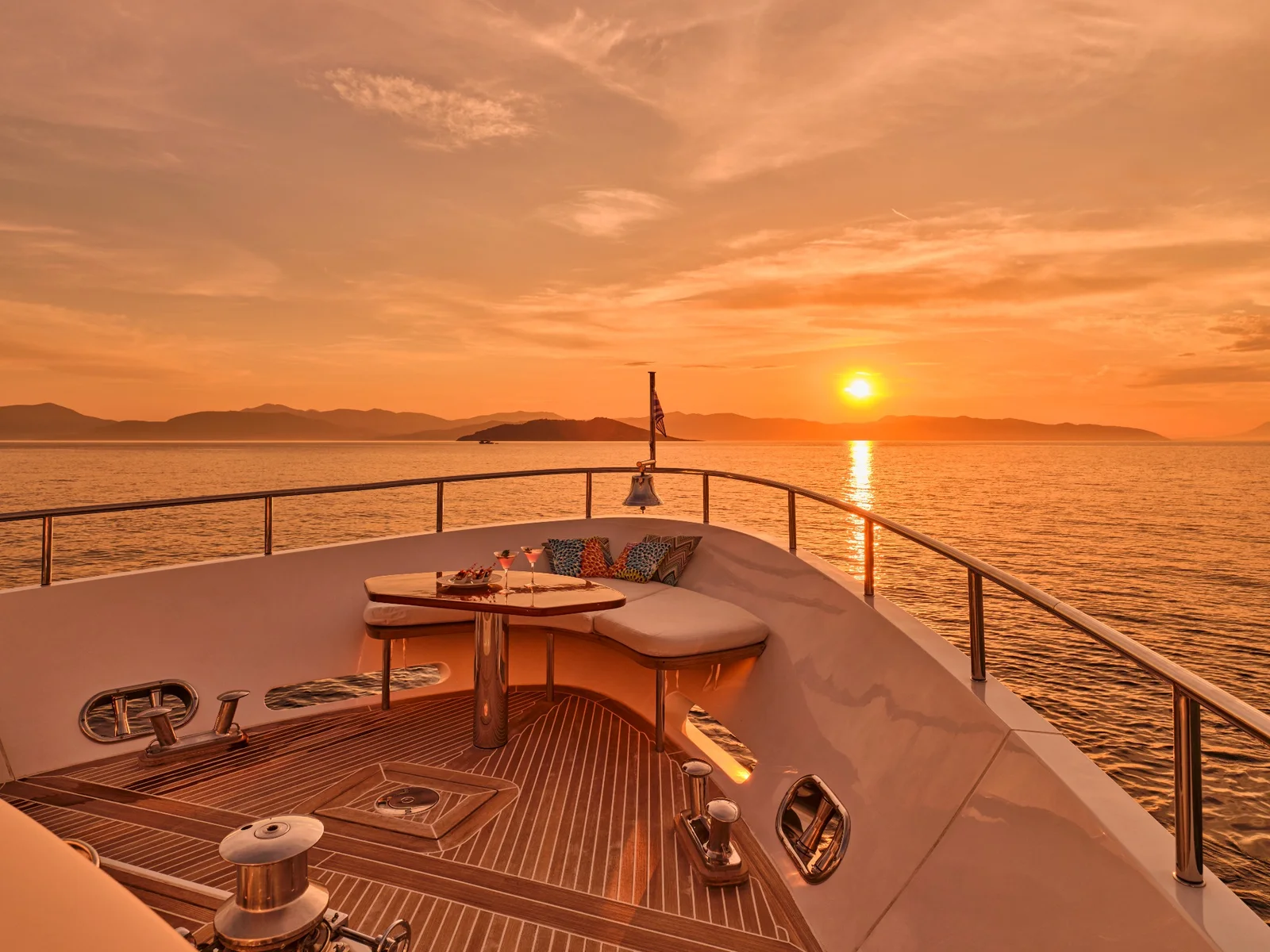 Bow of Solmare Yachting at sunset